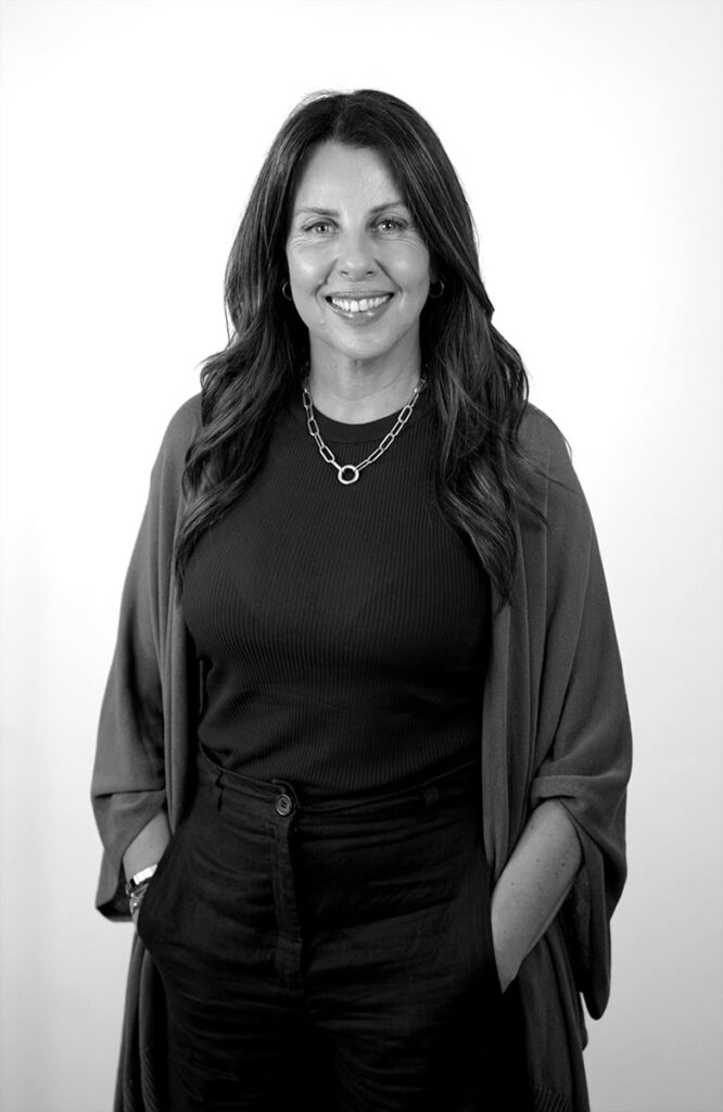 A black and white portrait of Marisa Farinha-Lloyd